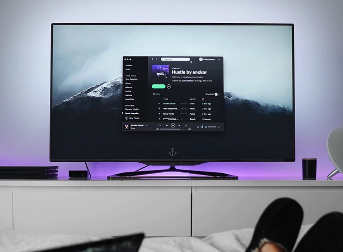 5dfd1a402217e0be75a57463 tv with stand in room UN